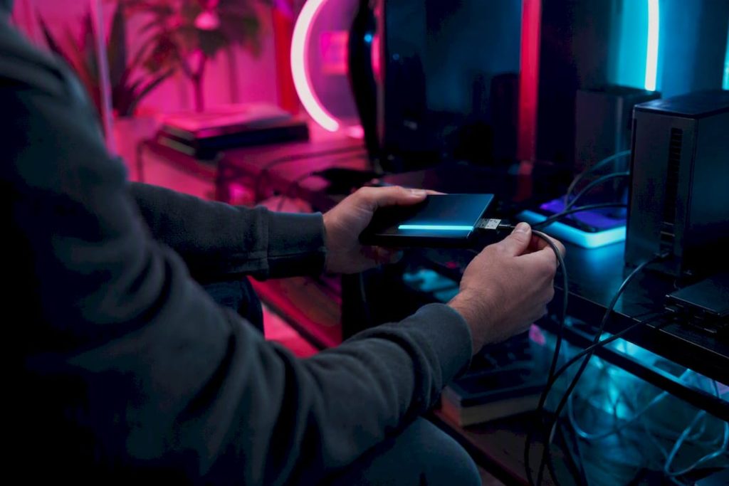 Deleting an AI Companion: What Actually Happens to Your Data Hands unplugging glowing data device on neon desk