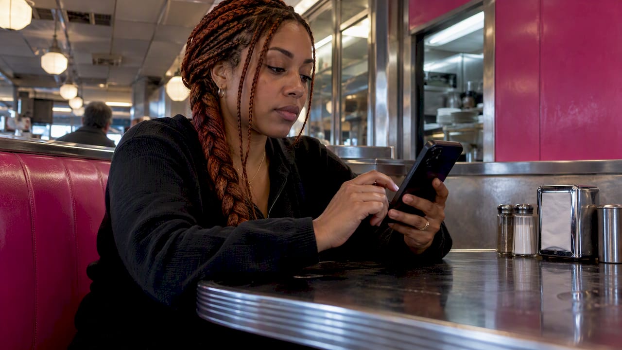 Woman reviewing an AI chat on phone