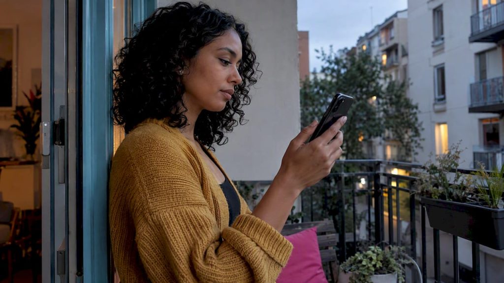 Woman pausing during an AI companion chat