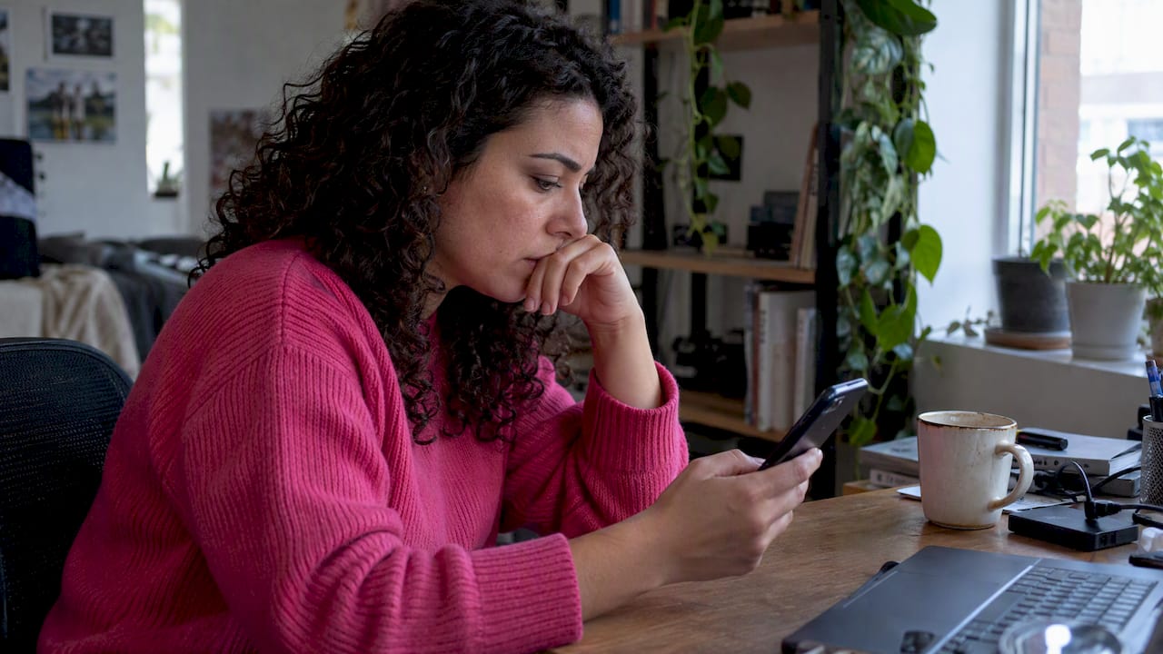 Person checking a breach notification at home