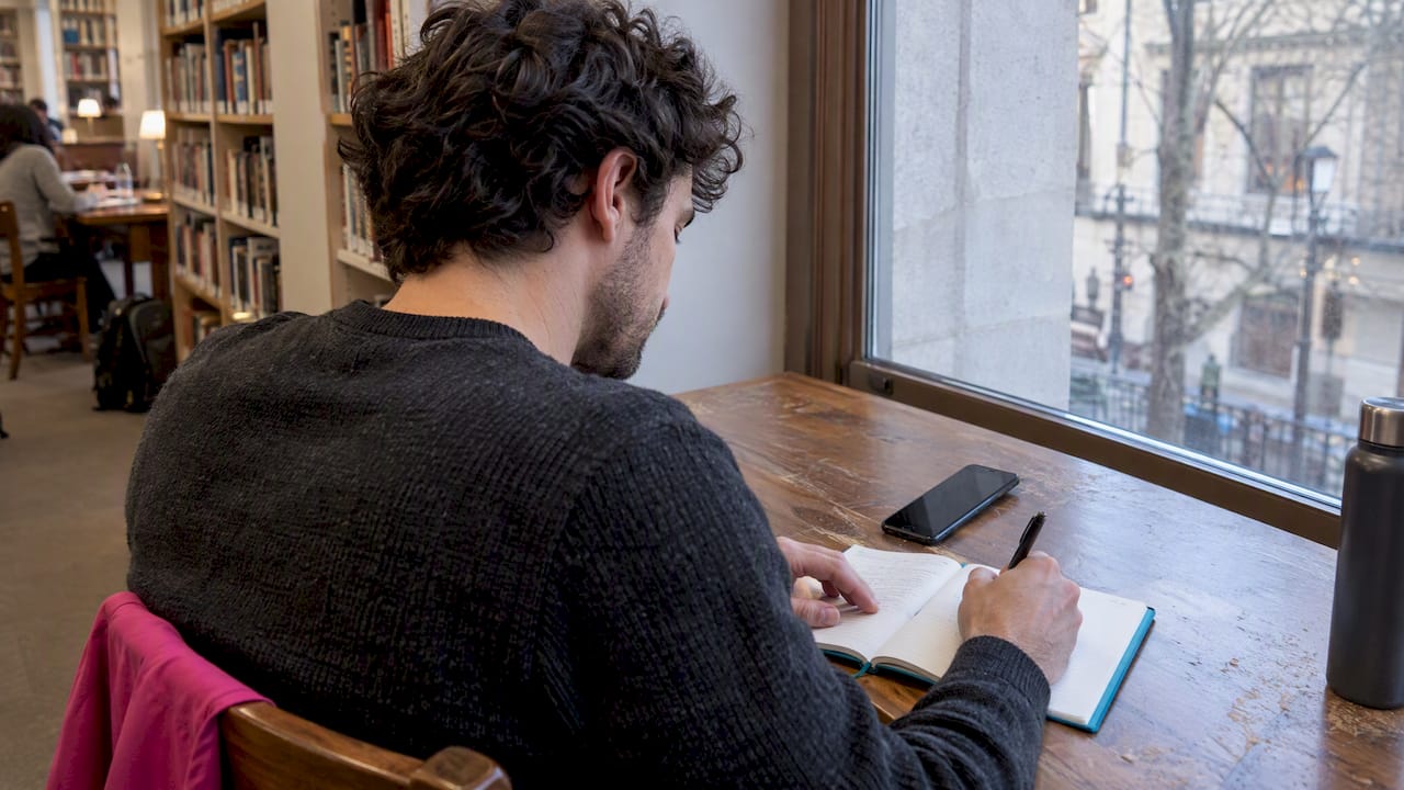 Person updating private notes before companion chat